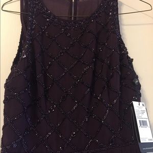 Plum-colored beaded evening gown